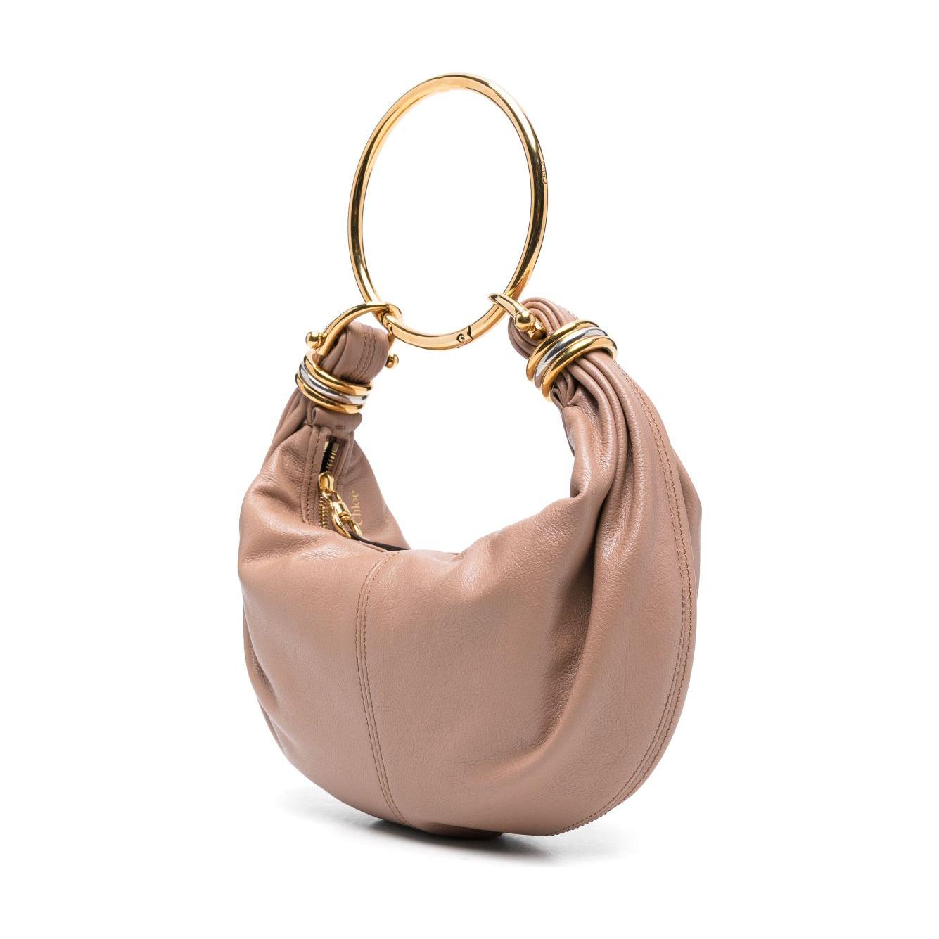 Front view with bag zipped and handles upright.