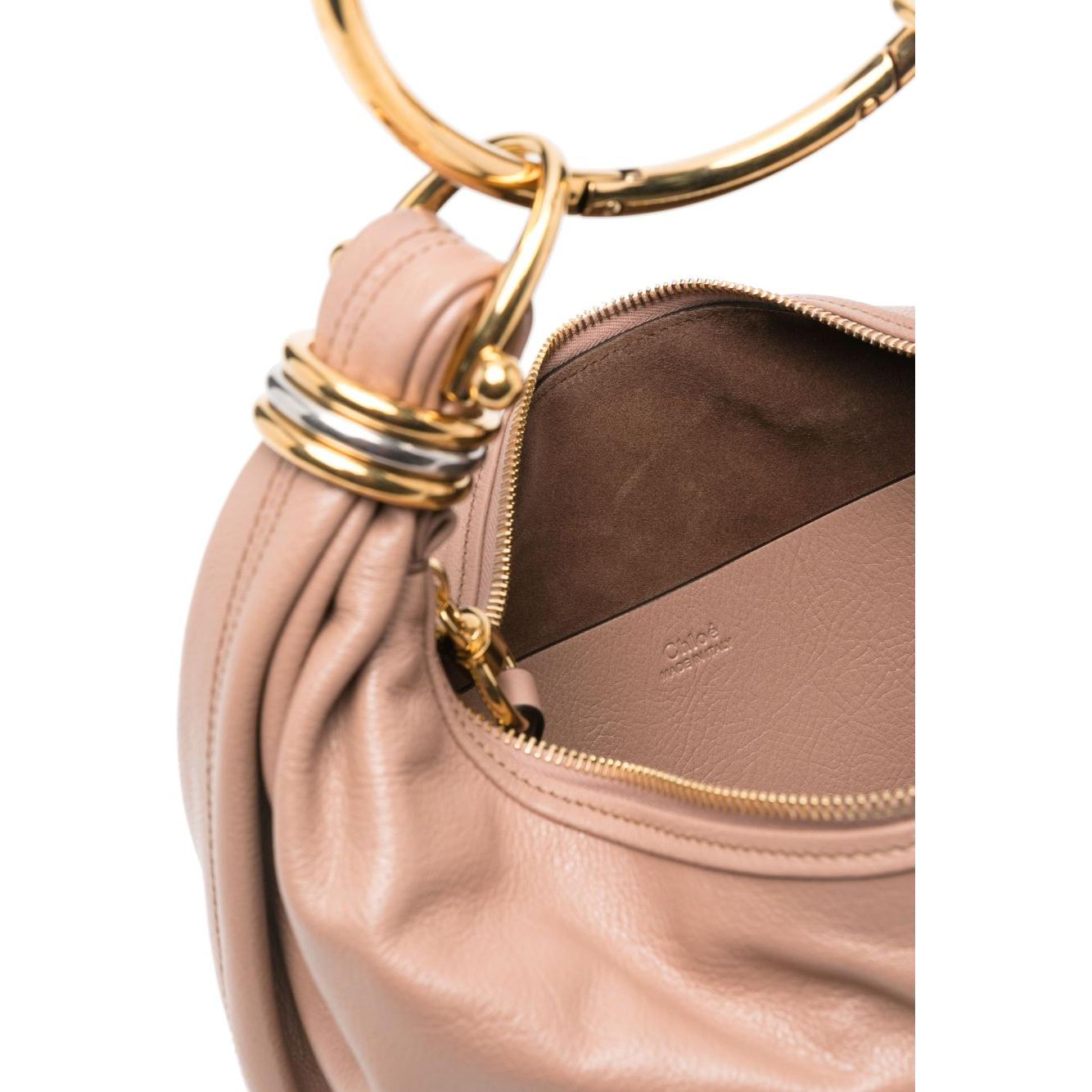 Front view with bag zipped and handles upright.