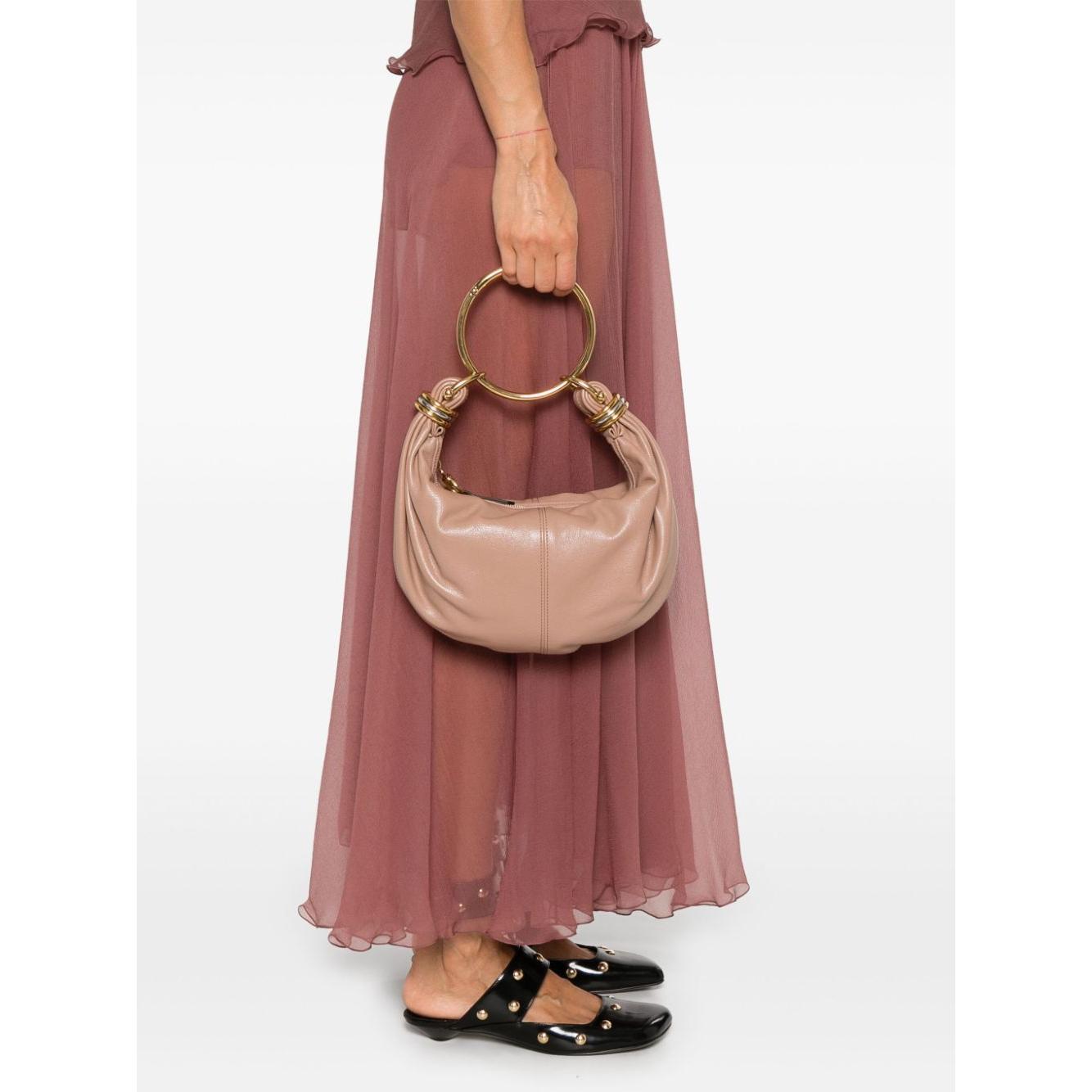 Front view with bag zipped and handles upright.
