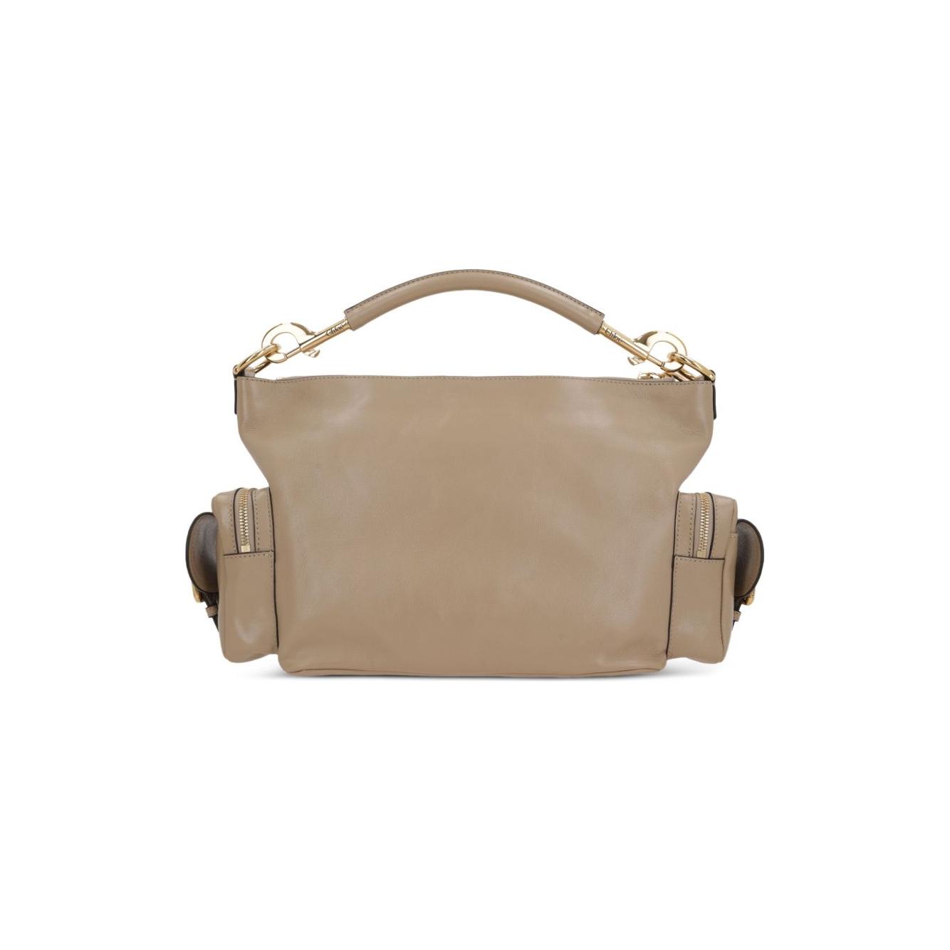 Front view with bag zipped and handles upright.