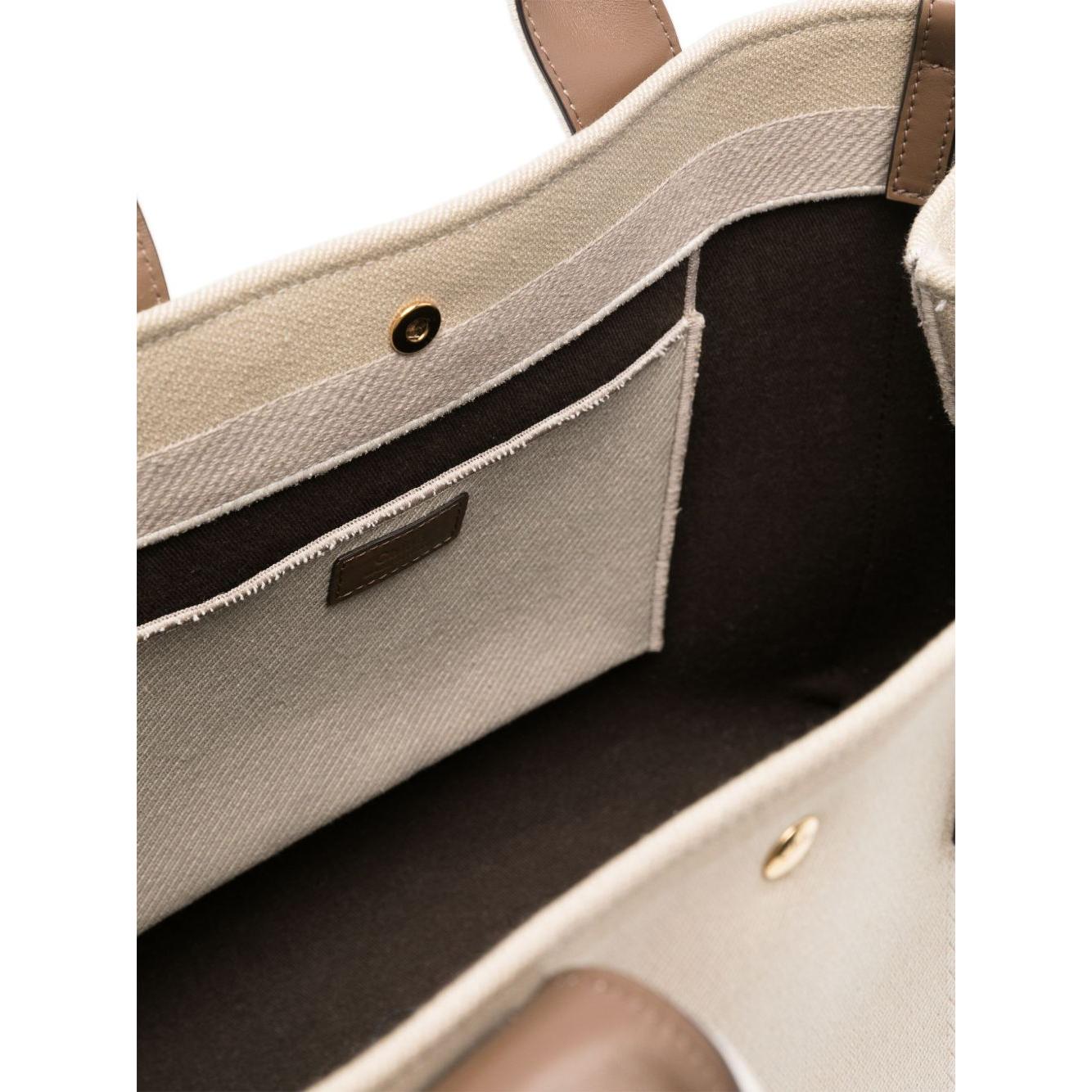 Front view with bag zipped and handles upright.
