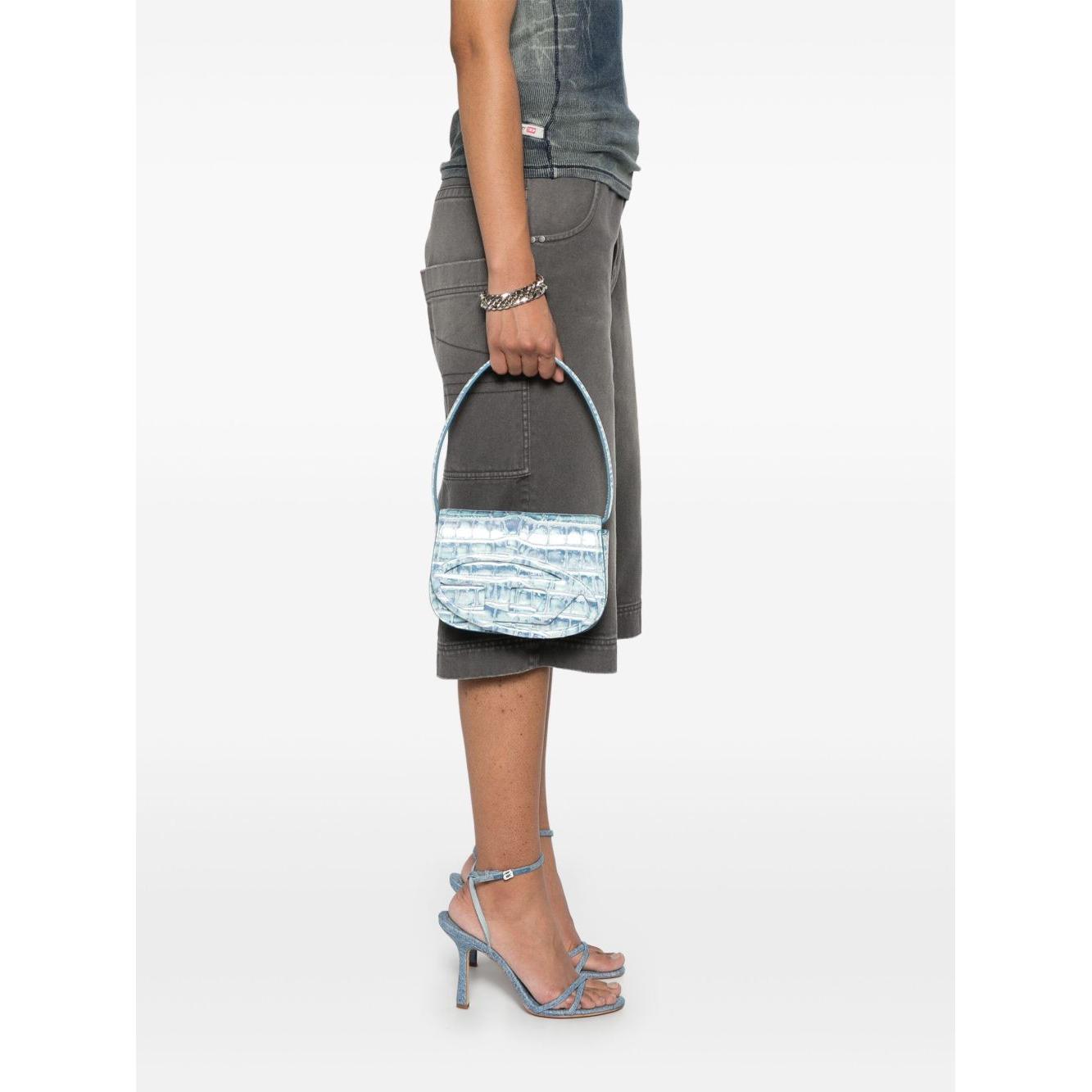 Front view with bag zipped and handles upright.