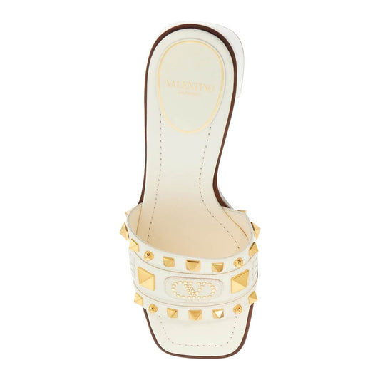 Valentino Garavani ivory leather slippers with golden studs and low heel Mules Valentino Garavani